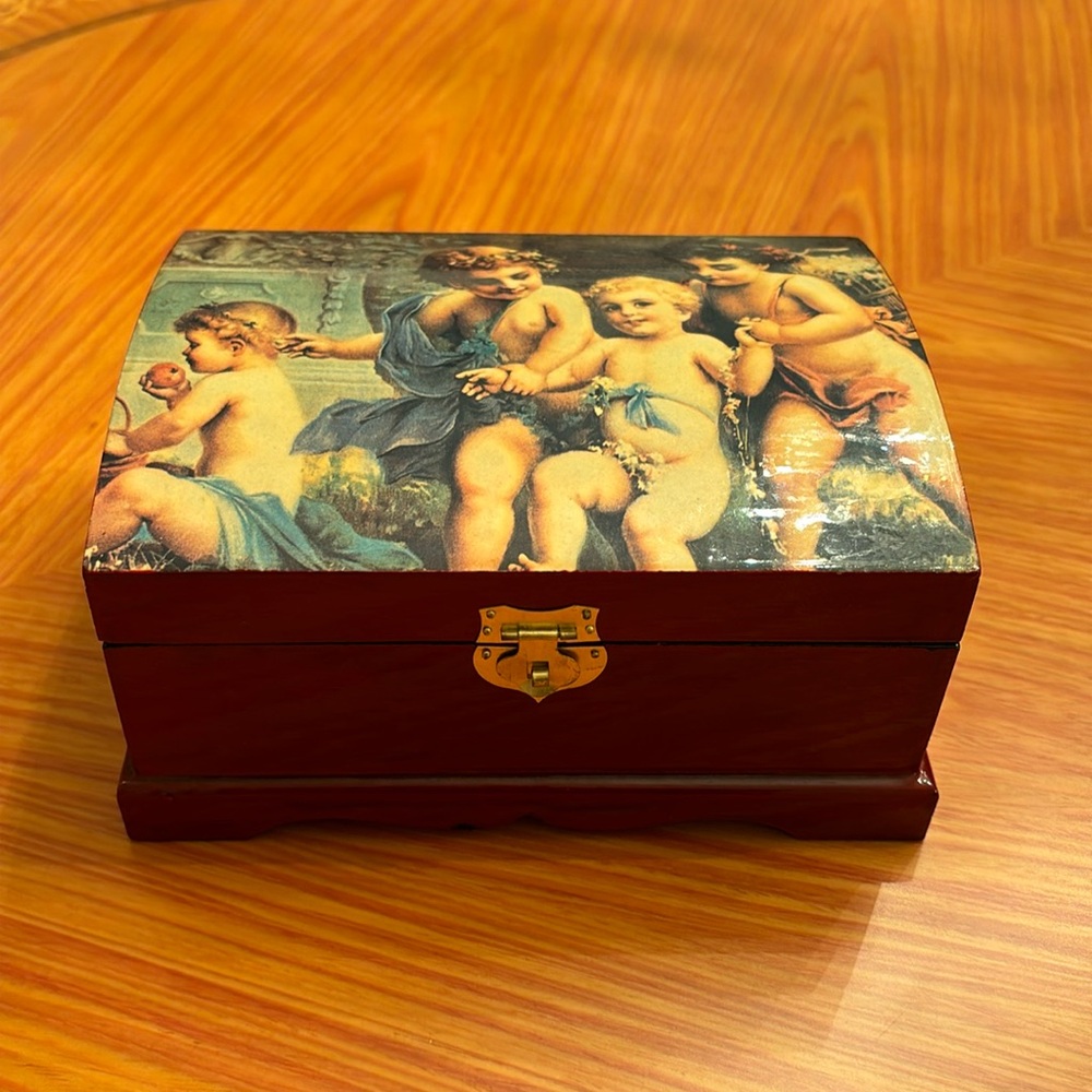 Vintage lacquer jewelry box with angels depicted